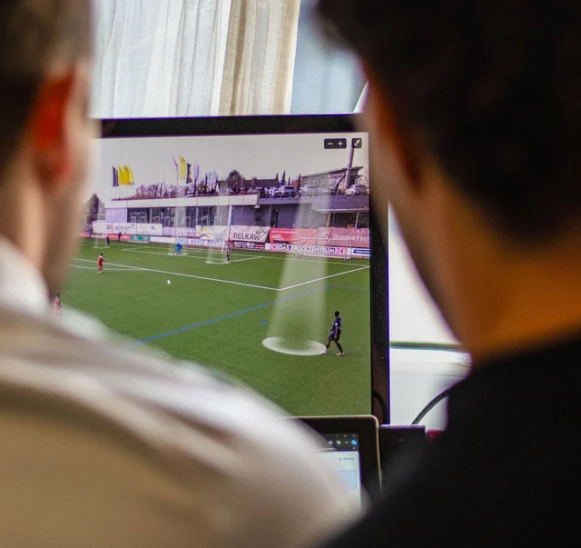 Coach reviewing a player’s match video with analysis software